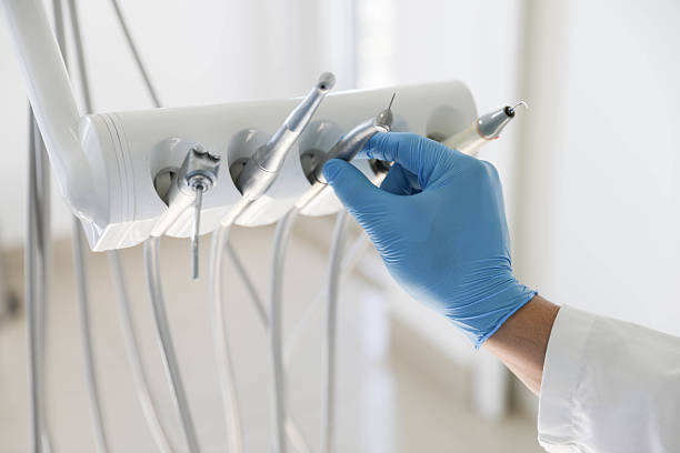 Professional Dental Implants technician working in Baxter Estates, NY